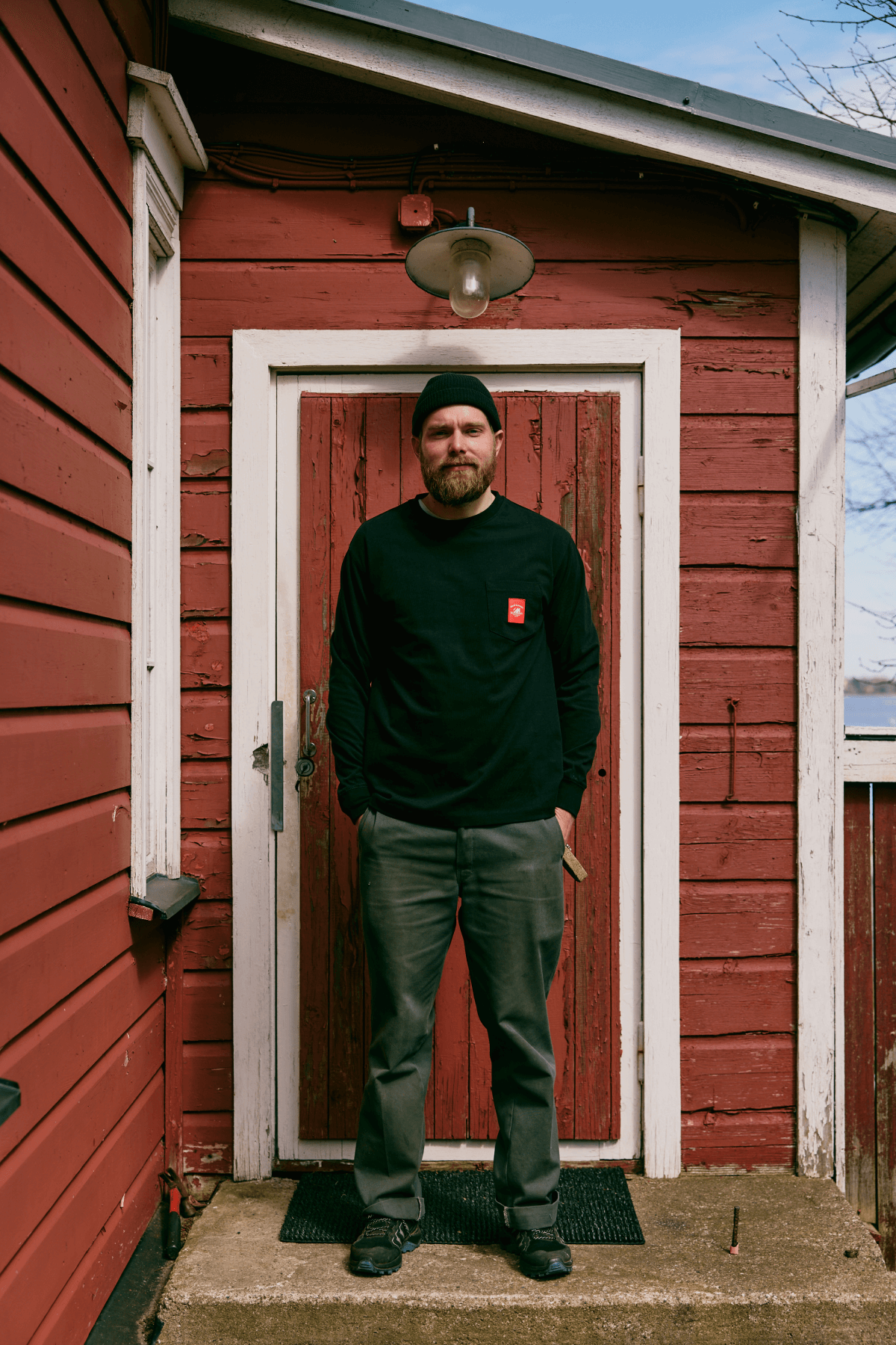 Male model wearing black Merenkävijät sweatshirt